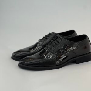 A striped patent leather lace-up shoe